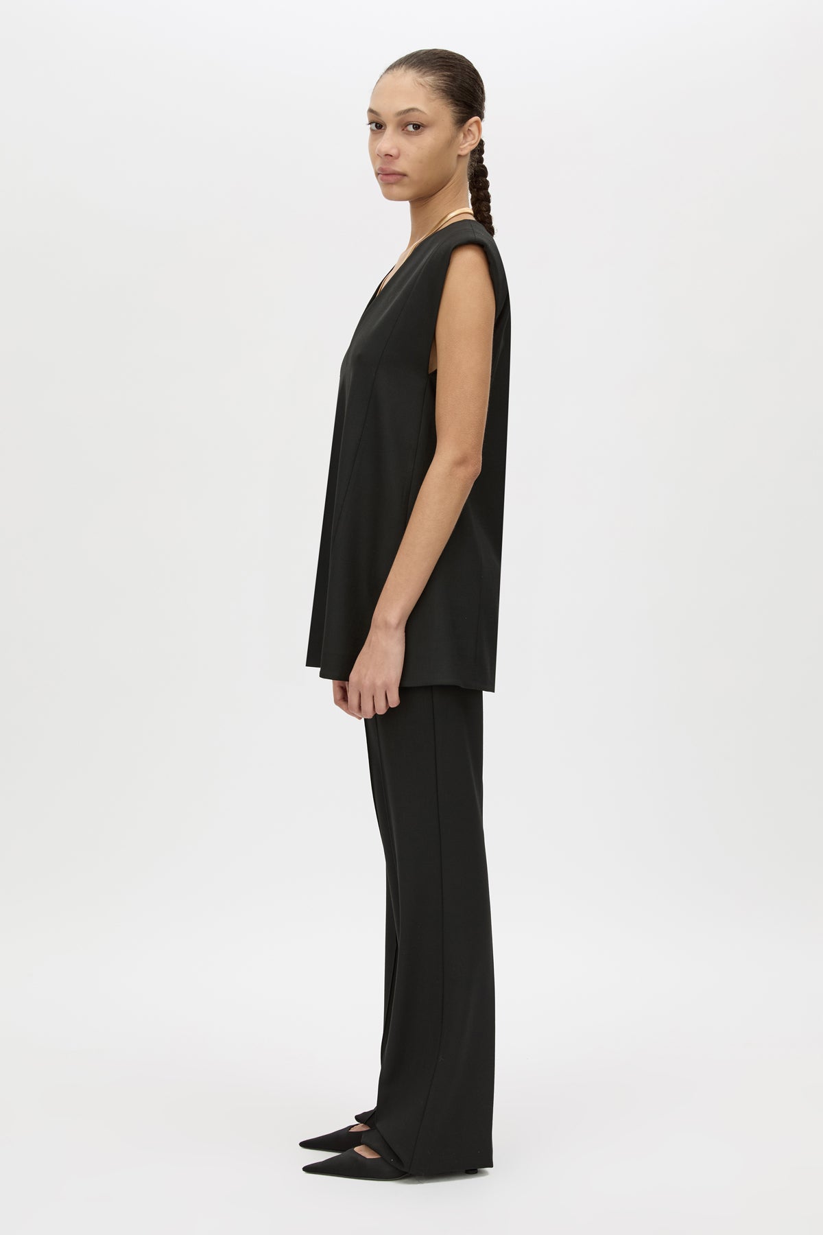 Side view CAMILLA AND MARC Cassie Top in Black with V‑neck sleeveless silhouette and removable snake‑chain detail.