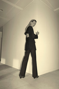 Styled CAMILLA AND MARC Cassie long sleeve mini dress in black with open back removable chain detail.
