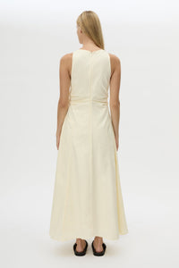Back view CAMILLA AND MARC Brera midi dress in pale yellow with topstitch details and side pockets.