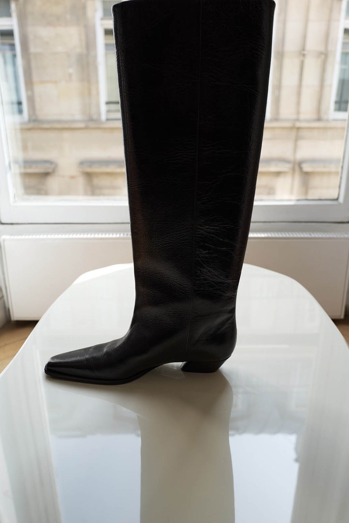 Styled view CAMILLA AND MARC Rowan Knee Boot in Black tumbled‑look Italian cow leather.