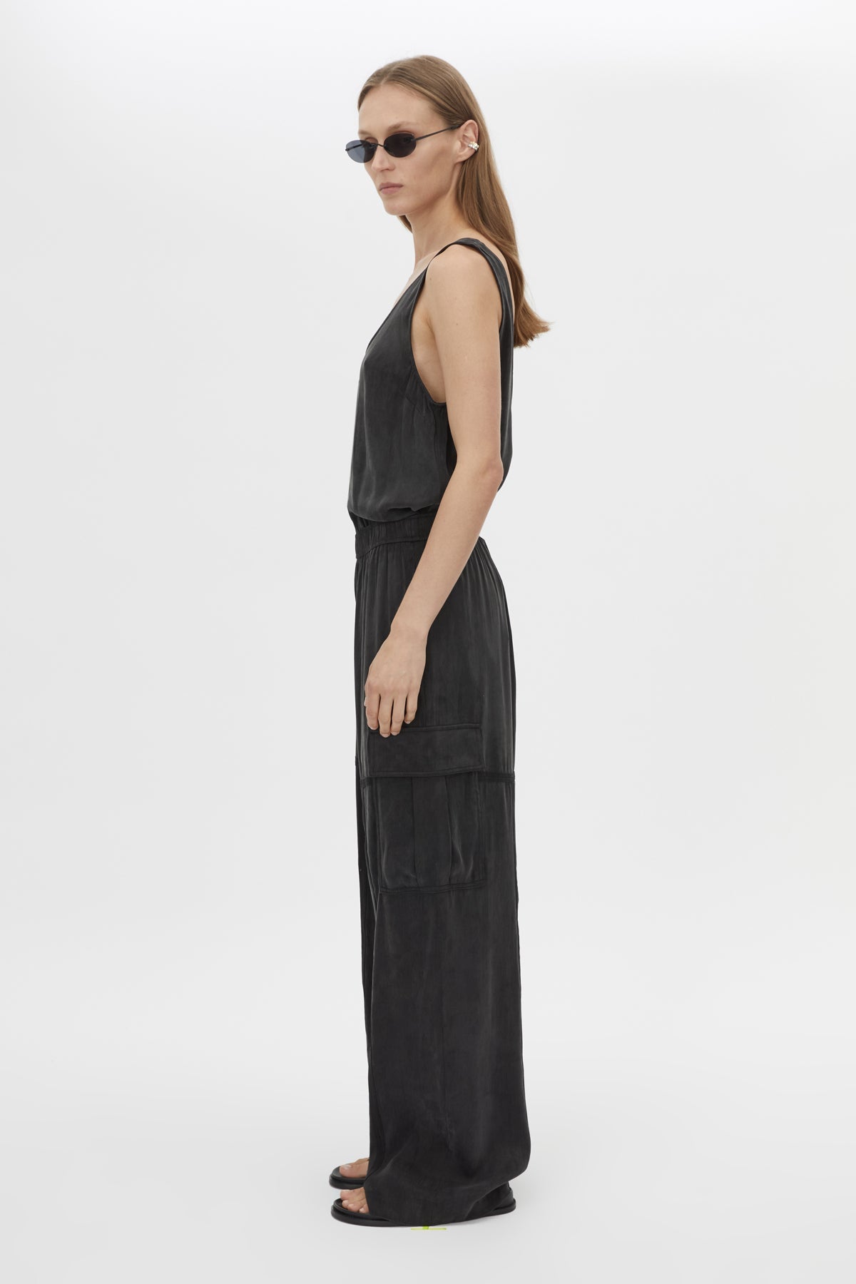 Side view CAMILLA AND MARC Allegro Satin Pant in Washed Black with mid‑rise cargo fit.