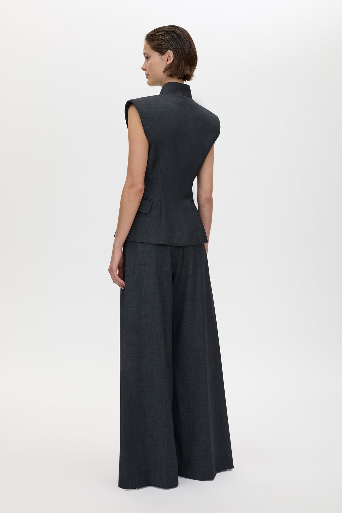 Back view CAMILLA AND MARC Ascent Double Breasted Vest in Dark Grey with tailored wool finish.