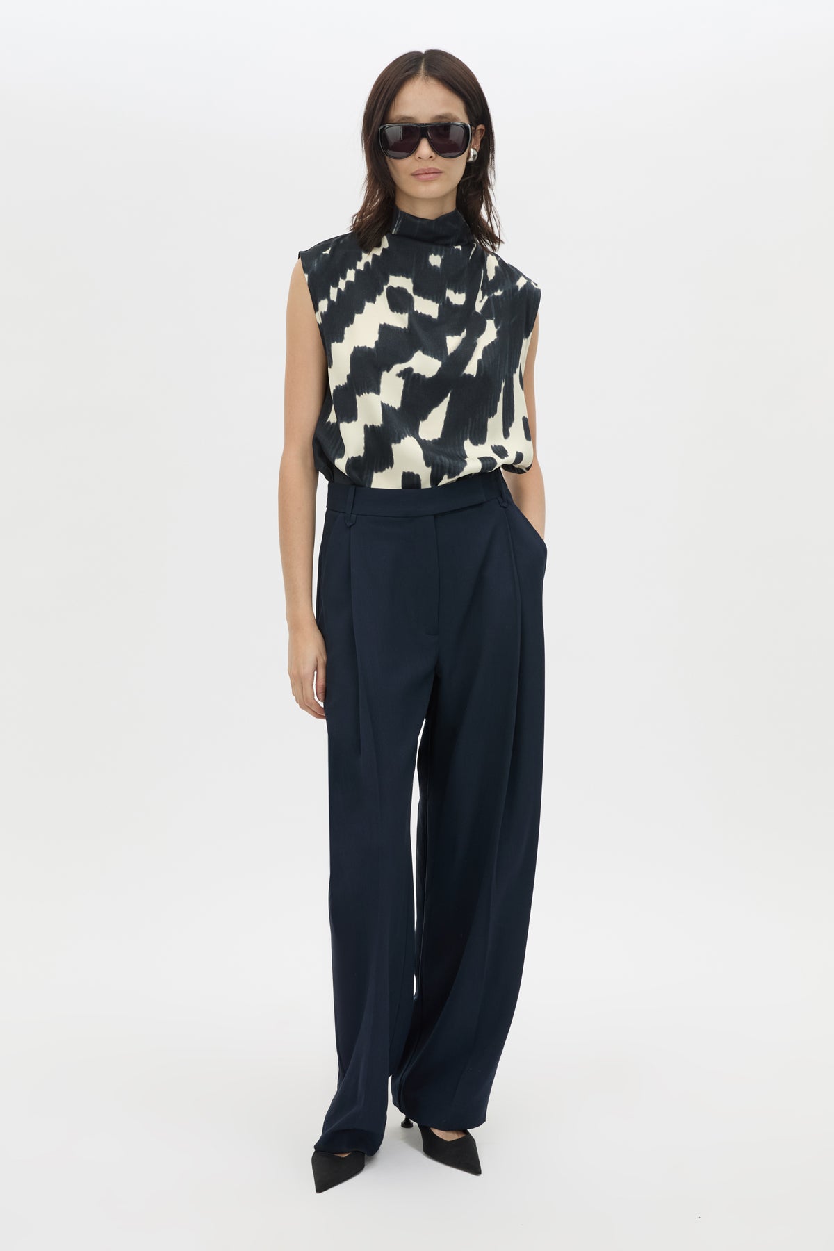 Front styled view CAMILLA AND MARC Asper Top in Navy print with sleeveless shell silhouette and high neckline.