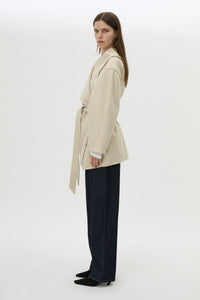 Side view CAMILLA AND MARC Audrey Wrap Jacket in oat with relaxed belted silhouette.