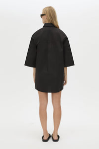 Back View CAMILLA AND MARC Avant collared black shirt dress with front symmetric pleat details. 