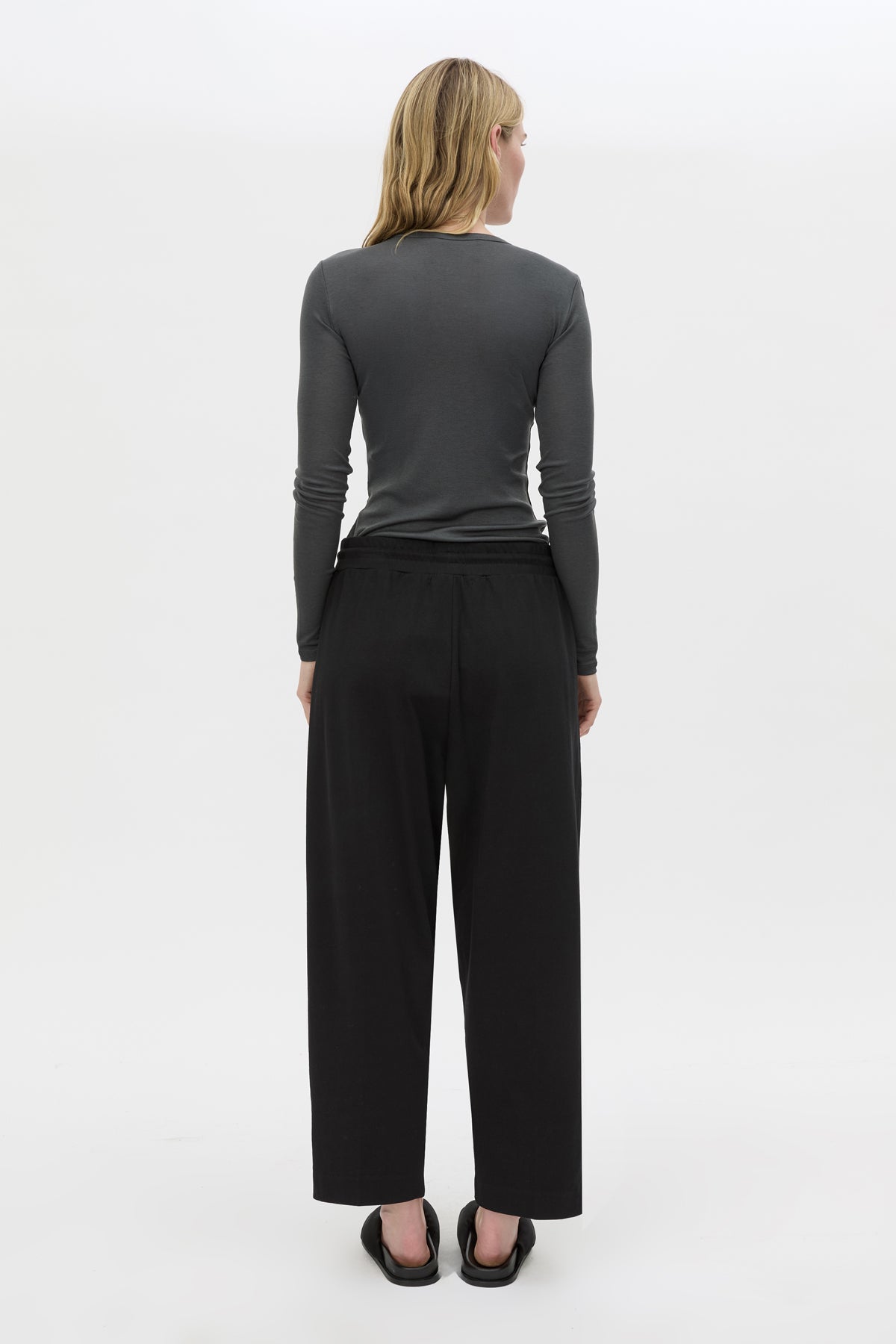 Back view CAMILLA AND MARC Beau Tapered Crop Pant in Black with elasticated waistband.