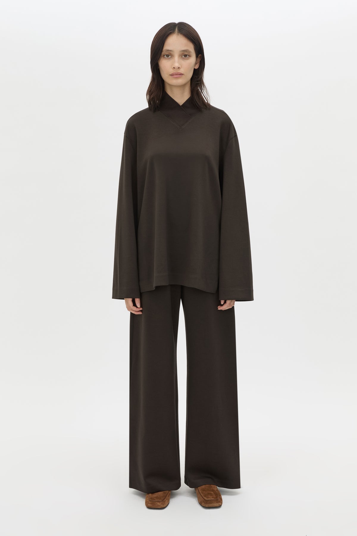 Front styled view CAMILLA AND MARC Bessette mid-rise lounge pant in brown with internal elasticated waistband.