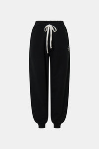 Ghost view CAMILLA AND MARC Bonnie relaxed logo track pant in black with elasticated drawcord waistband.