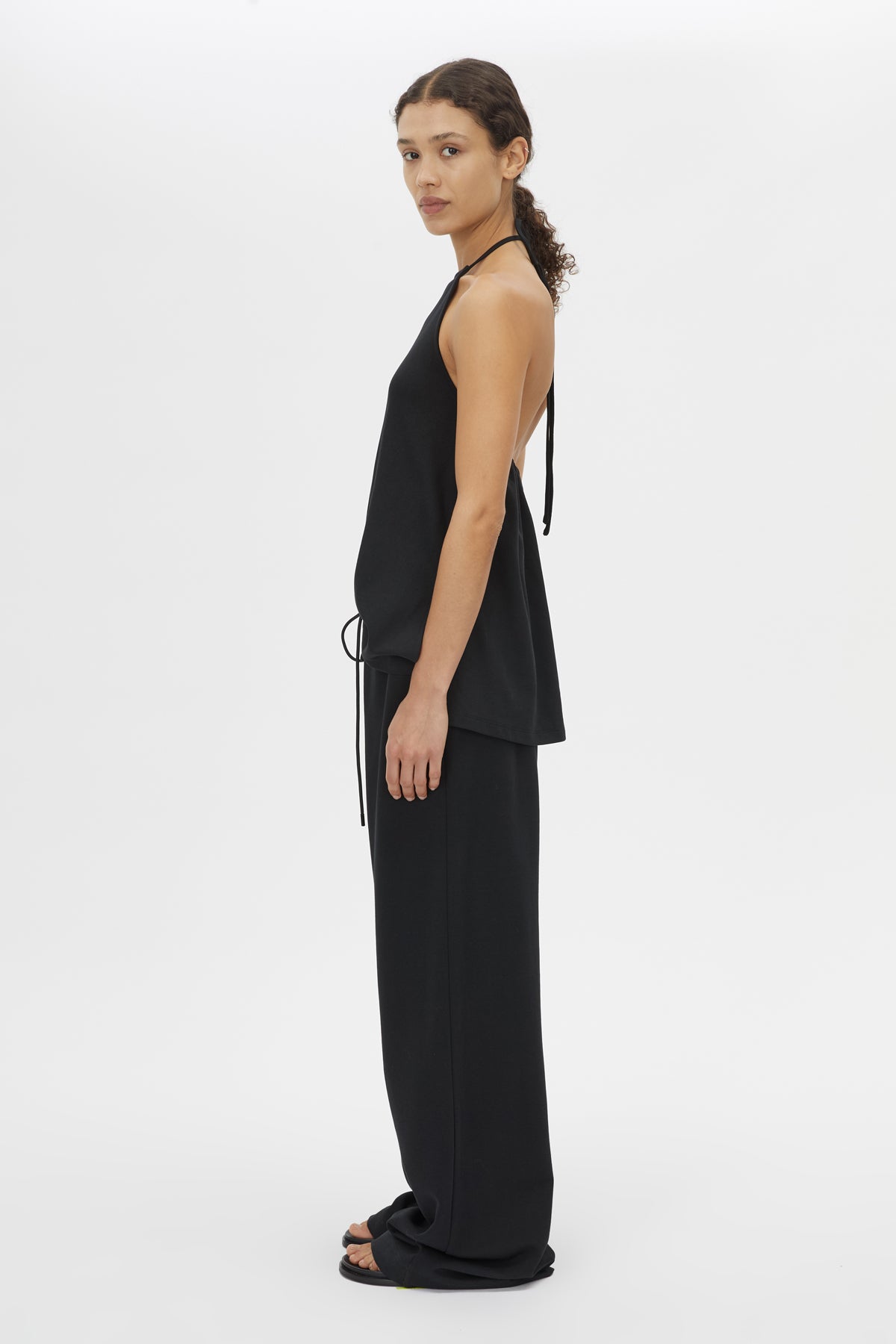 Side view CAMILLA AND MARC Canova Relaxed Pant in Black jersey with gathered waistband and drawcord.