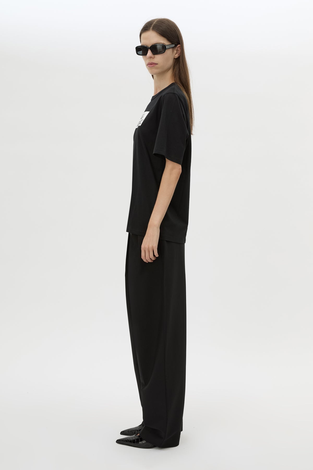 Side view CAMILLA AND MARC Carmont Graphic Tee in Black with white graphic logo.