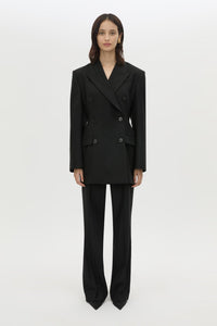 Front styled view CAMILLA AND MARC Cassie long sleeve mini dress in black with open back removable chain detail.