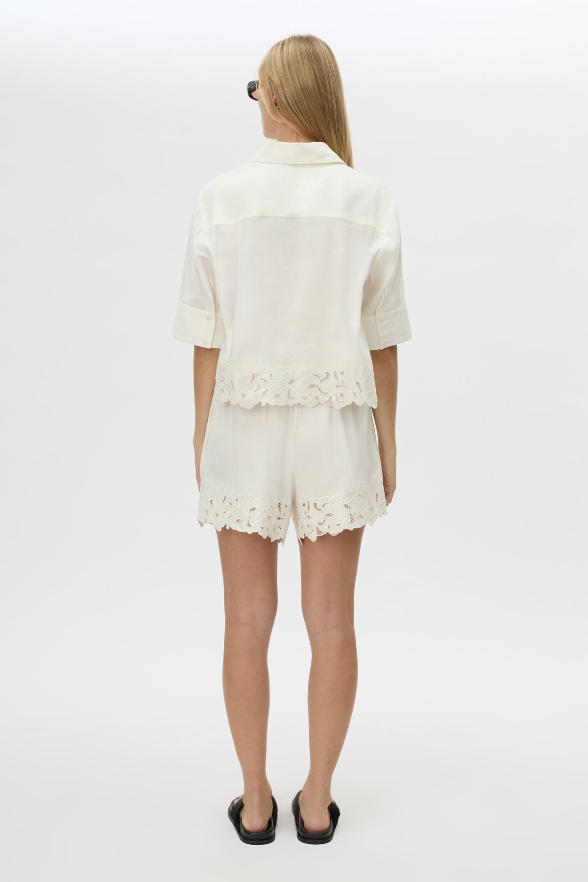 Back view CAMILLA AND MARC Chara Embroidered Cropped Shirt in Cream with short sleeves, lace hem and slight A‑line fit.