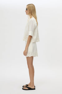 Side view CAMILLA AND MARC Chara Embroidered Short in Cream with embroidered hem, and elastic waistband.