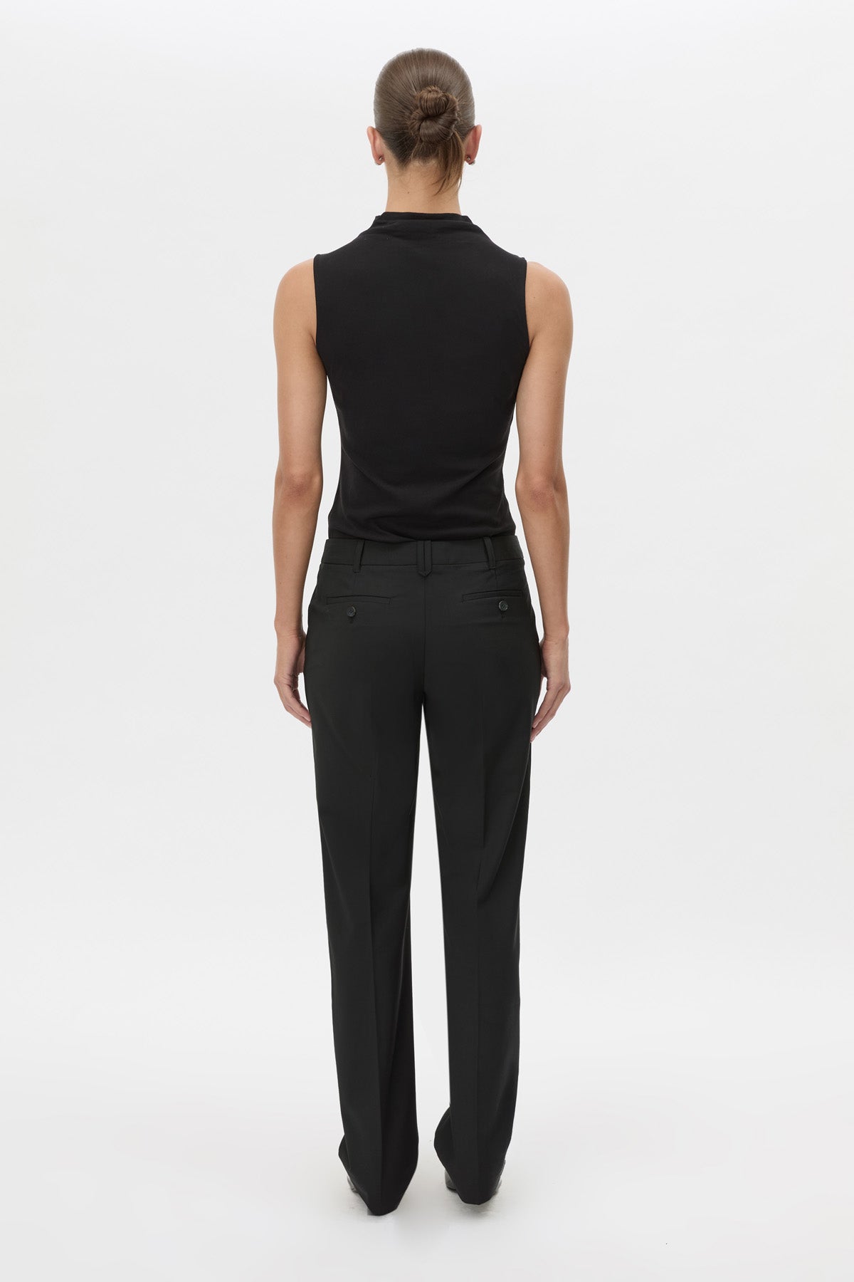 Back view CAMILLA AND MARC Chiaro Slim-Fit Pant in black with low‑waisted, tailored waistband.