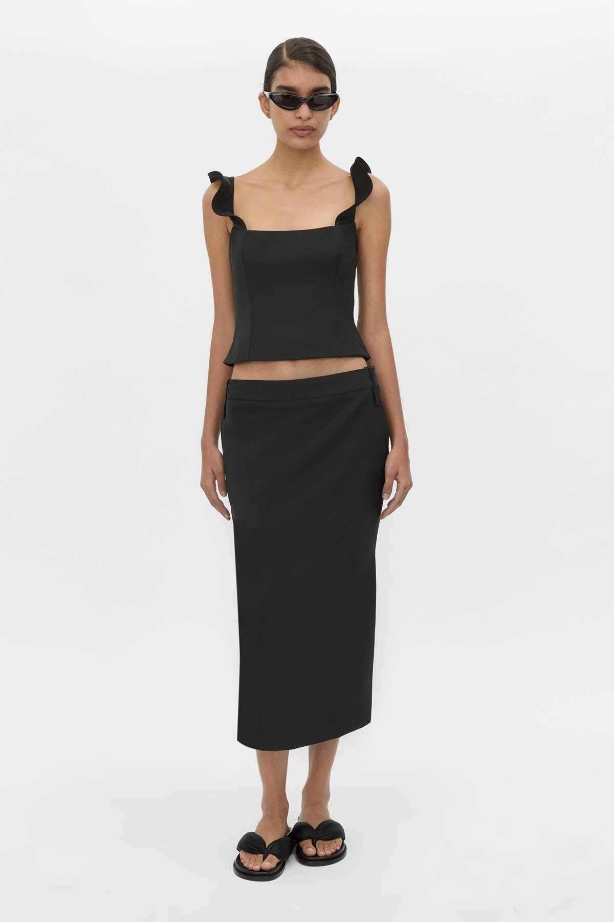 Front-styled view CAMILLA AND MARC Chiaro Midi Skirt in black with low‑rise fit.