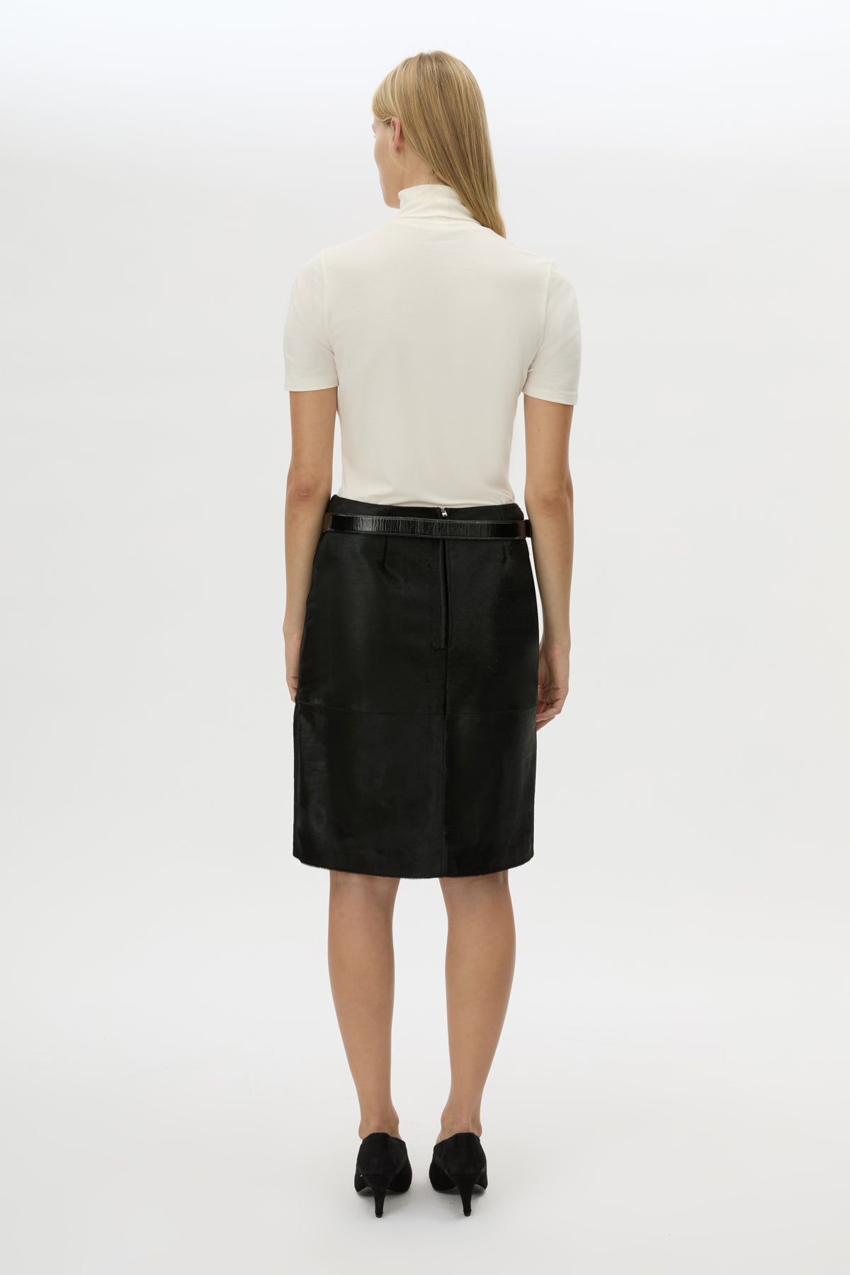 Back view CAMILLA AND MARC Contour Leather Skirt in Black with mid‑rise, pencil fit.
