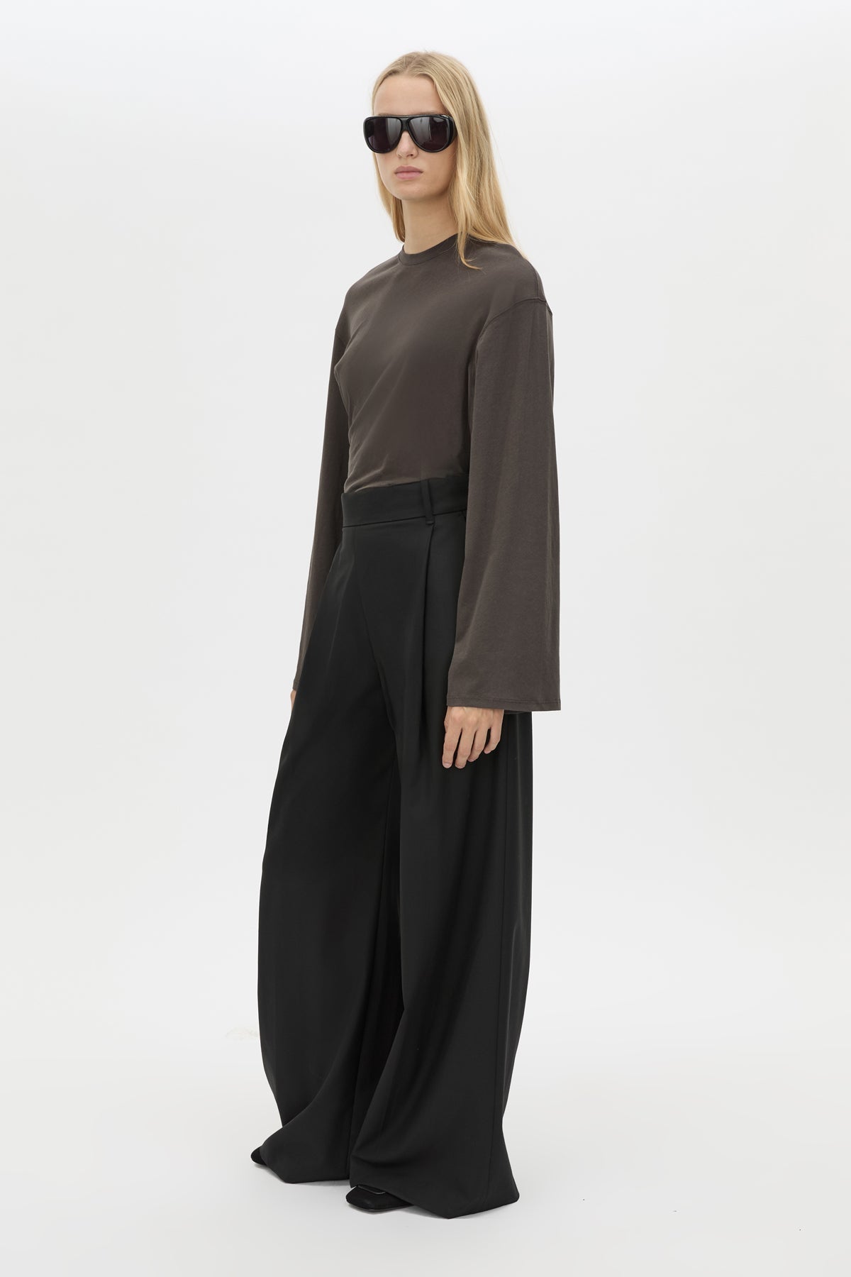 3/4 view CAMILLA AND MARC Dakota long sleeve relaxed top in charcoal grey with crew neckline and semi-sheer fabrication