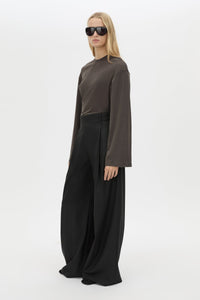 3/4 view CAMILLA AND MARC Dakota long sleeve relaxed top in charcoal grey with crew neckline and semi-sheer fabrication