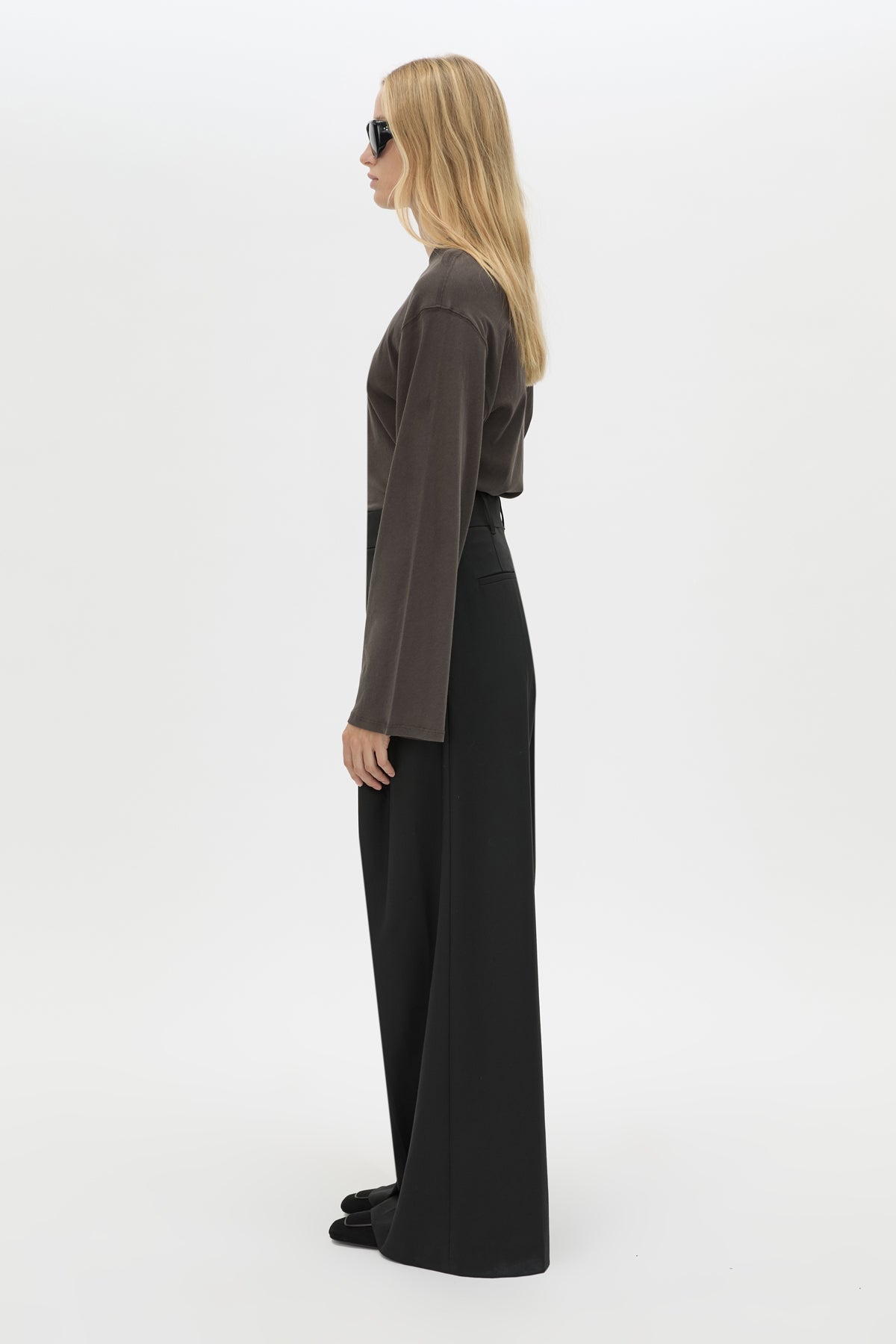 Side view CAMILLA AND MARC Dakota long sleeve relaxed top in charcoal grey with crew neckline and semi-sheer fabrication.