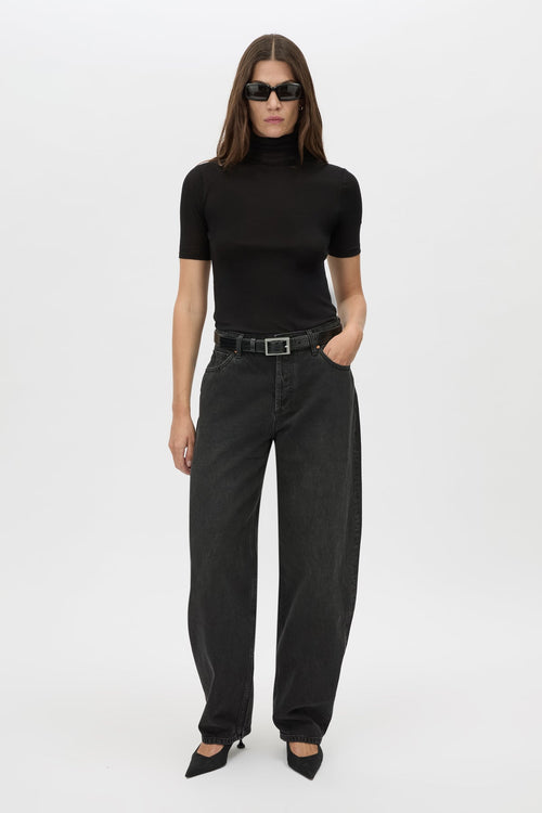 Front styled view CAMILLA AND MARC Dakota Elbow Sleeve Top in black with turtleneck.
