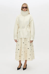 Front view CAMILLA AND MARC Drea funnel neck puffer jacket in cream with utility waistbelt and detachable throat latch.