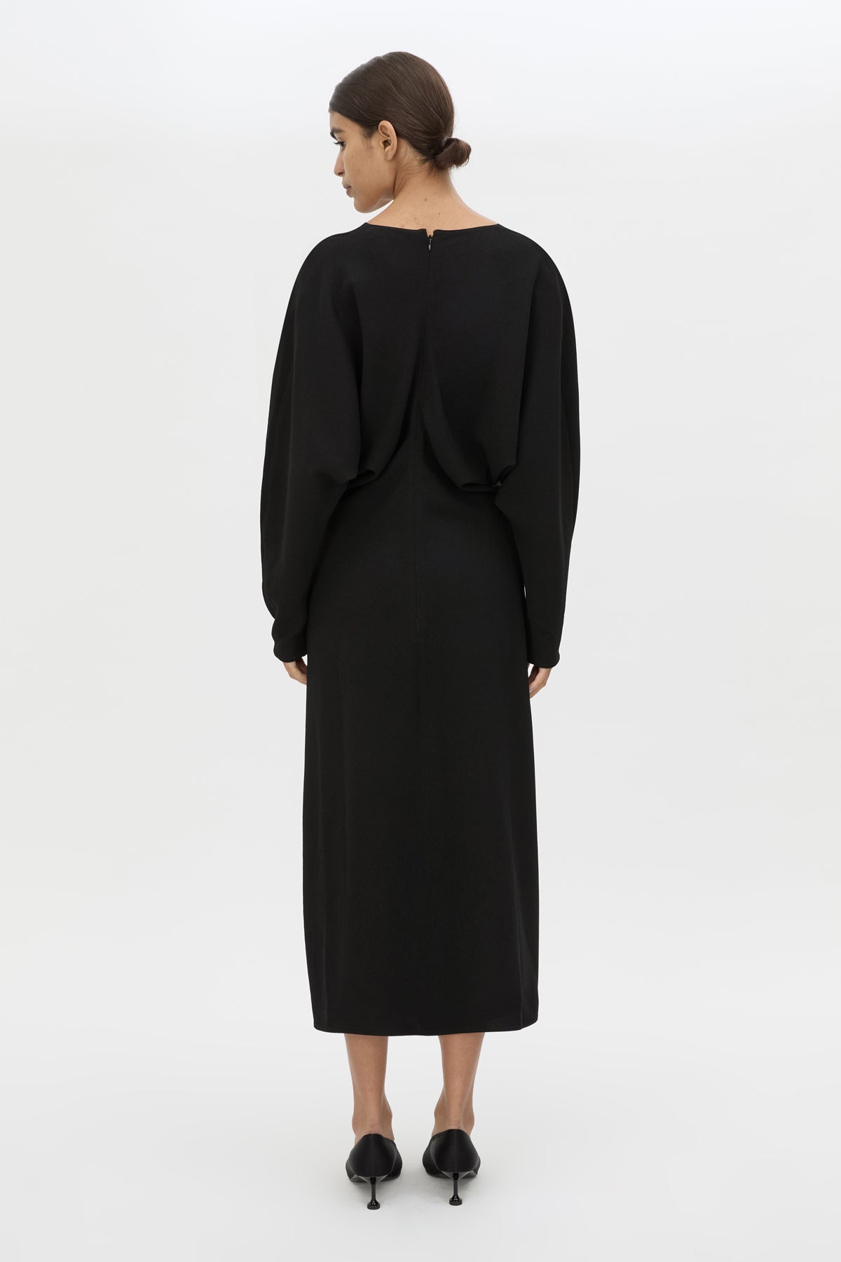 Back view CAMILLA AND MARC Dune Draped Waist Midi Dress in Black with gathered waist detailing.