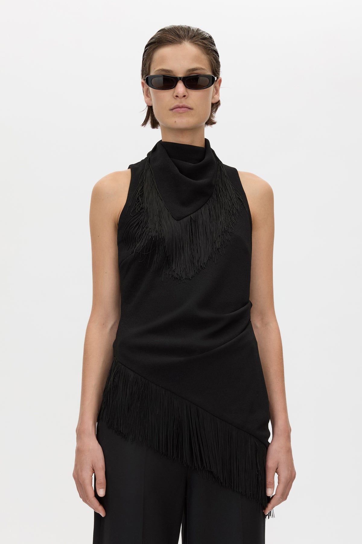 Cropped view CAMILLA AND MARC Dune Fringe Top in Black with asymmetric cut, gathered waist, high neck and fringe scarf.