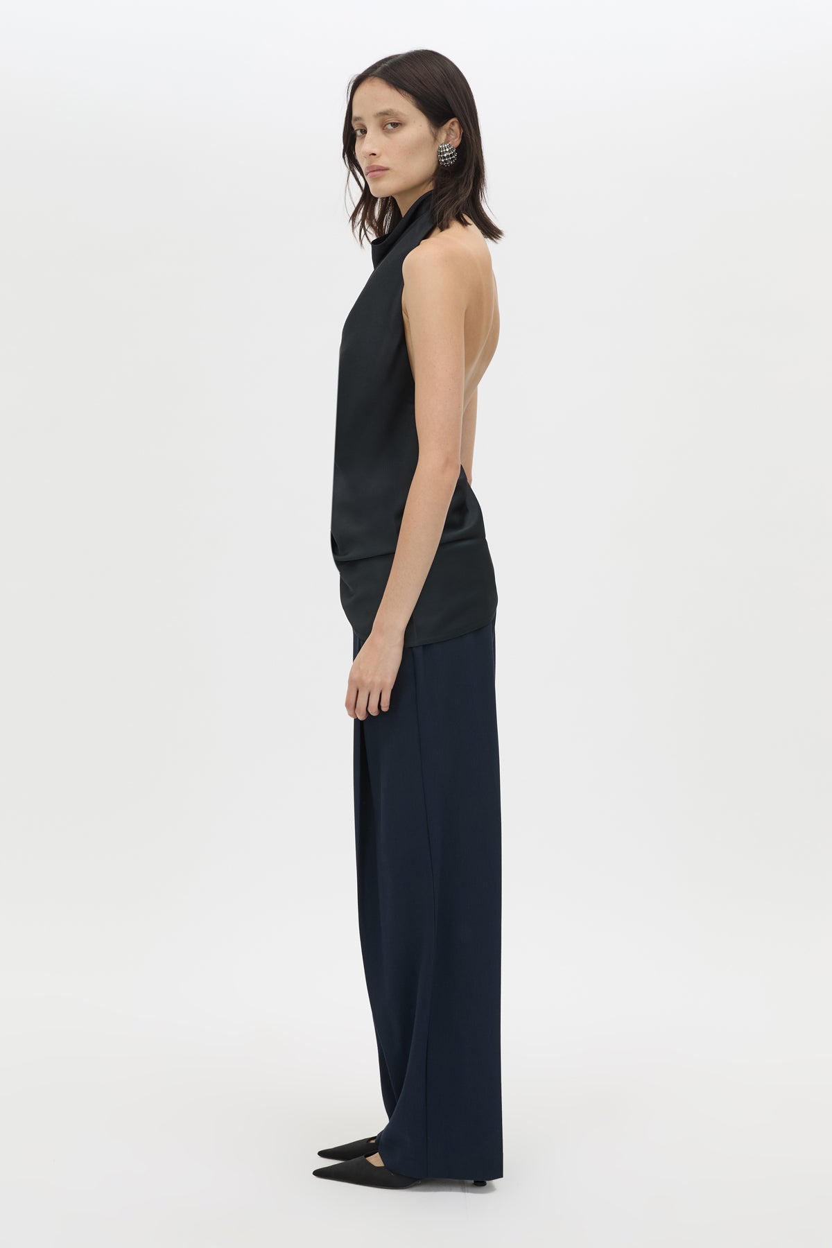 Side view CAMILLA AND MARC Elowyn Halter Top in French Navy with a draped open back and asymmetric hem.
