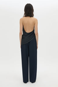 Back view CAMILLA AND MARC Elowyn Halter Top in French Navy with a draped open back and asymmetric hem.