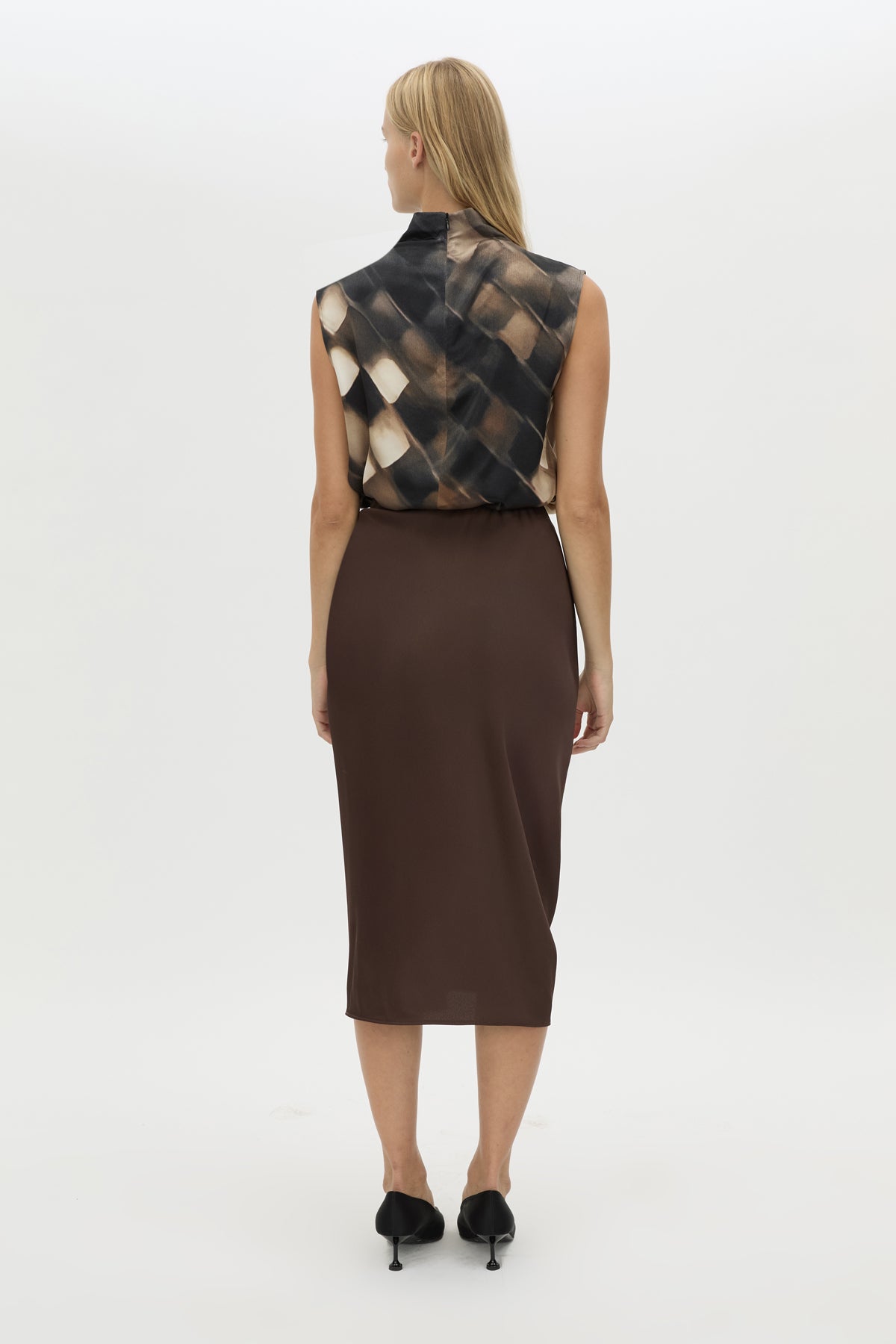 Back view CAMILLA AND MARC Elowyn Wrapped Midi Skirt in Espresso Brown with front draped detailing.