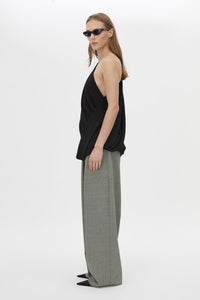 Side view CAMILLA AND MARC Eon Top in Black with a draped asymmetric silhouette.