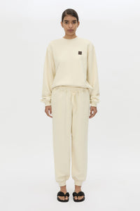 Front view CAMILLA AND MARC Idris Track Pant in Ecru styled with the Idris Tracksuit Top.