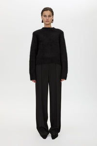 Front styled view CAMILLA AND MARC Ines Knit Sweater in Black with brushed knit texture and ribbed crew neckline.