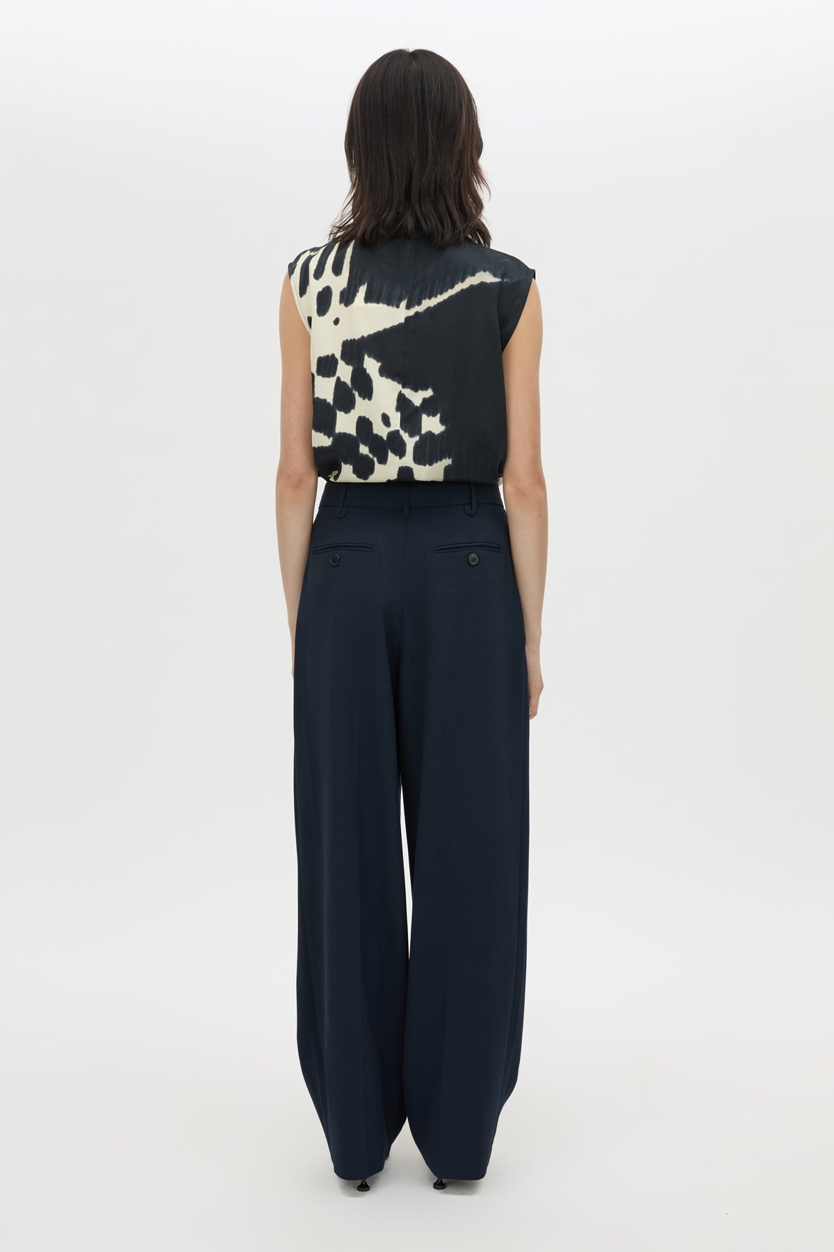 Back view CAMILLA AND MARC Lena Pant in Navy featuring a mid‑rise tailored cut with front tucks.