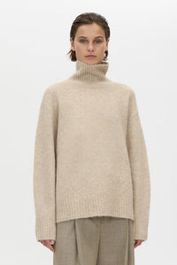 Cropped view CAMILLA AND MARC Leonie Turtleneck Knit Sweater in Oatmeal Marle with relaxed fit, ribbed collar and ribbed hems.
