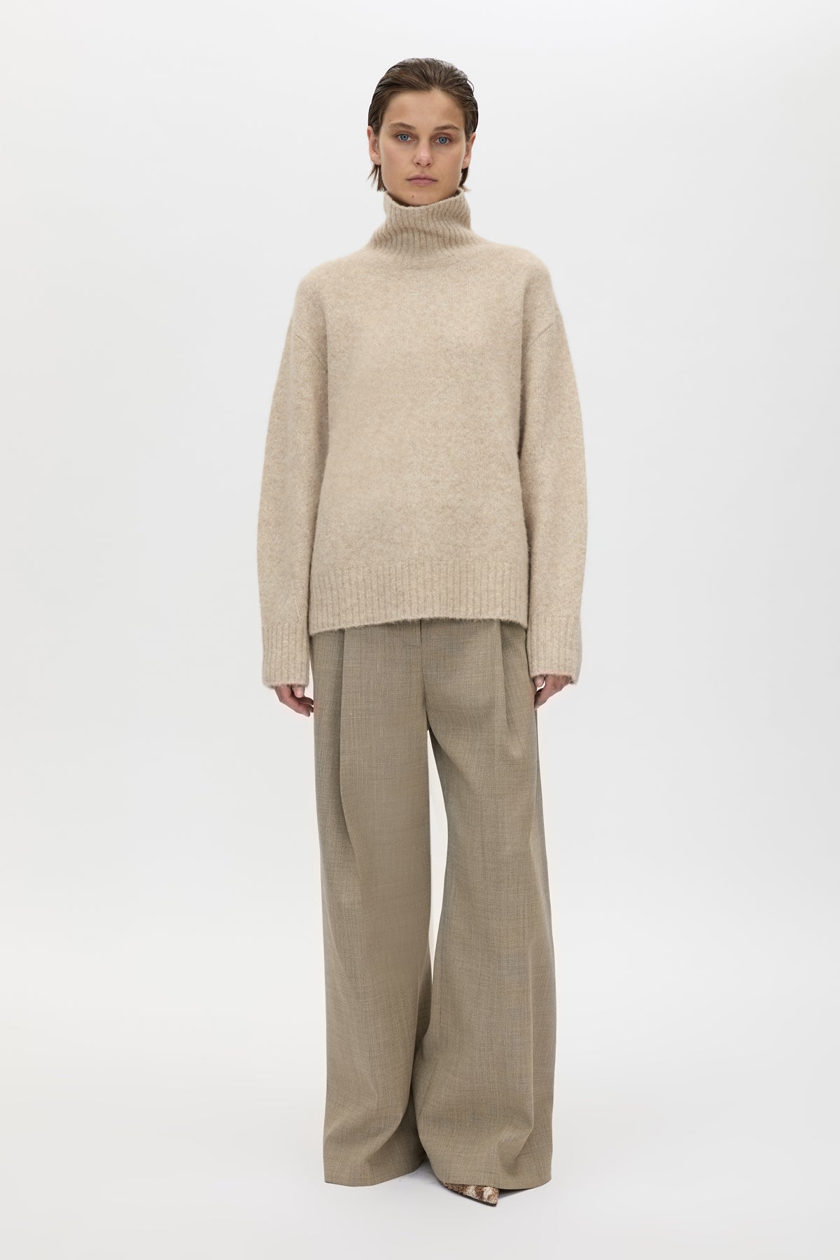 Front view CAMILLA AND MARC Leonie Turtleneck Knit Sweater in Oatmeal Marle with relaxed fit, ribbed collar and ribbed hems.