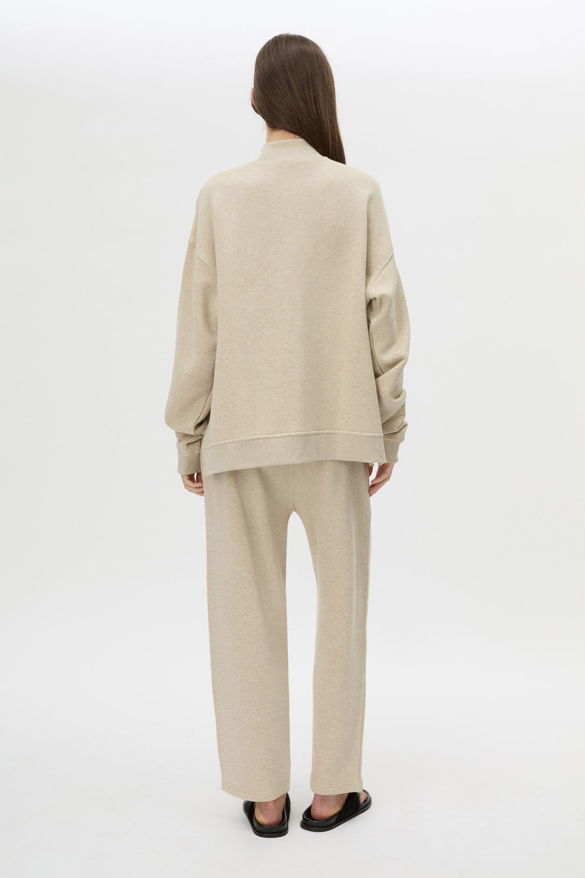 Back view CAMILLA AND MARC Lloyd Sweater in Cream with a ribbed turtleneck and an embroidered chest monogram.