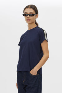 Cropped view CAMILLA AND MARC Locus Tee in Navy with fitted baby‑tee silhouette and contrast stripe tape.  