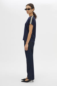 Side view CAMILLA AND MARC Locus Tee in Navy with fitted baby‑tee silhouette and contrast stripe tape.  