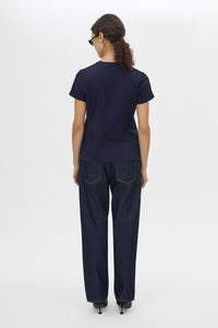 Back view CAMILLA AND MARC Locus Tee in Navy with fitted baby‑tee silhouette and contrast stripe tape.  