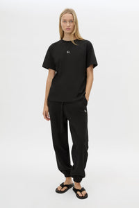 Front view CAMILLA AND MARC Lyra Logo Tee in Black with a 100% cotton fabrication.