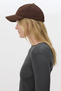 Side view CAMILLA AND MARC Maren Embroidered Cap in Chocolate Brown with front embroidered artwork.