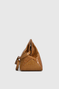 Side view CAMILLA AND MARC Mette Croc Bag in tan croc‑embossed leather.