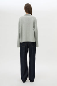 Back view CAMILLA AND MARC Moreno Long Sleeve Polo Top in Grey Marle with quarter button placket, and embroidered monogram.
