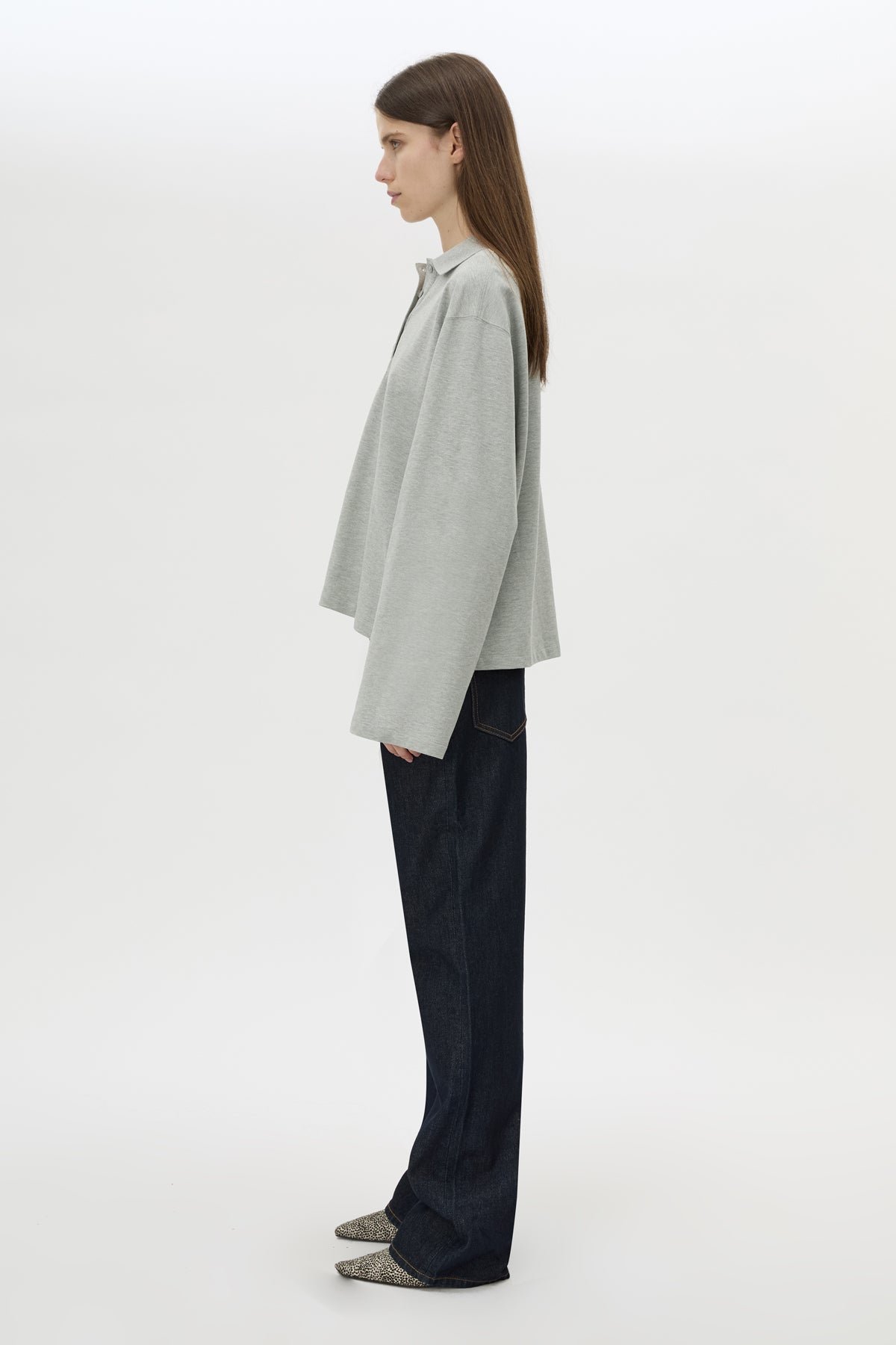 Side view CAMILLA AND MARC Moreno Long Sleeve Polo Top in Grey Marle with quarter button placket, and embroidered monogram.