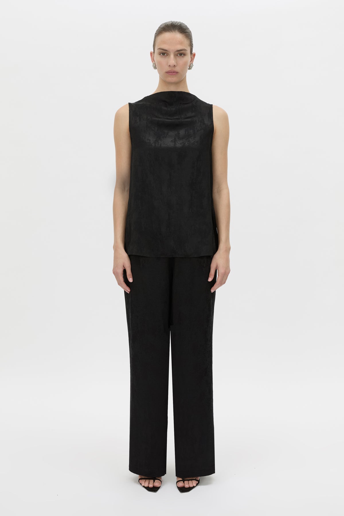 Front-styled view CAMILLA AND MARC Naidee Satin Sleeveless Top in black with sleeveless shell design in satin fabrication.