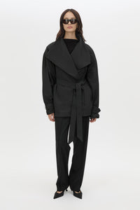 Front view CAMILLA AND MARC Nasir Cropped Jacket in Black with high‑neck, double‑breasted wrap design.