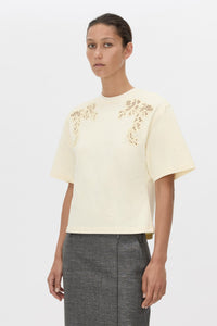 Cropped view CAMILLA AND MARC Niami Crochet Tee in cream with crochet detailing at the shoulder.