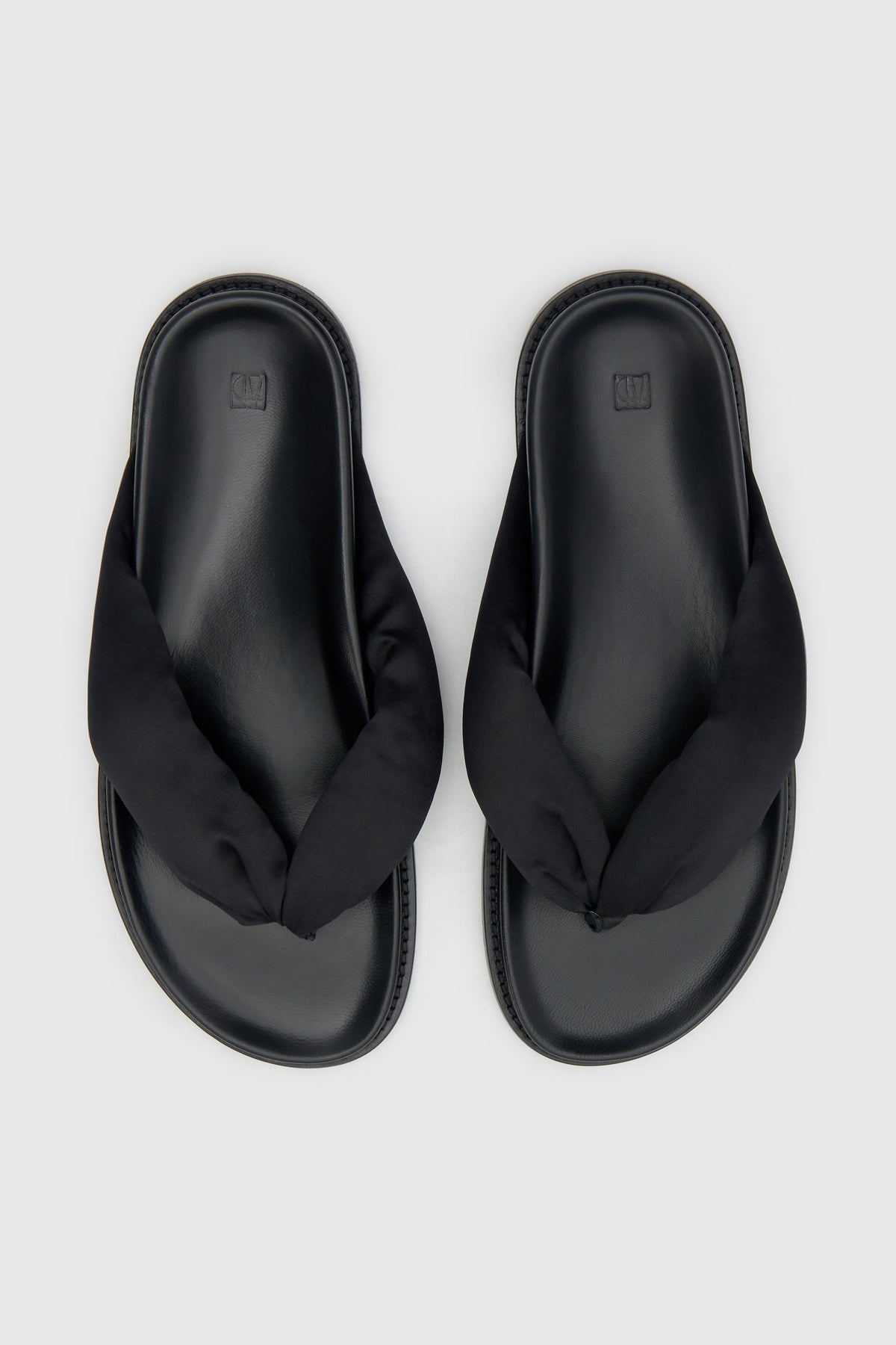Top view CAMILLA AND MARC Nina Slide Sandal in Black with padded satin straps.