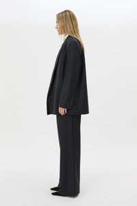 Side view CAMILLA AND MARC Orban Oversized Blazer in Navy pinstripe with double‑breasted button closure.